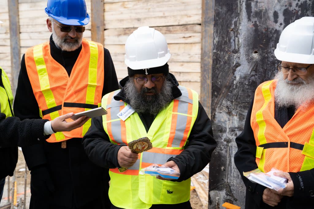 Clergy blessing the foundation of the community centre, November 2023