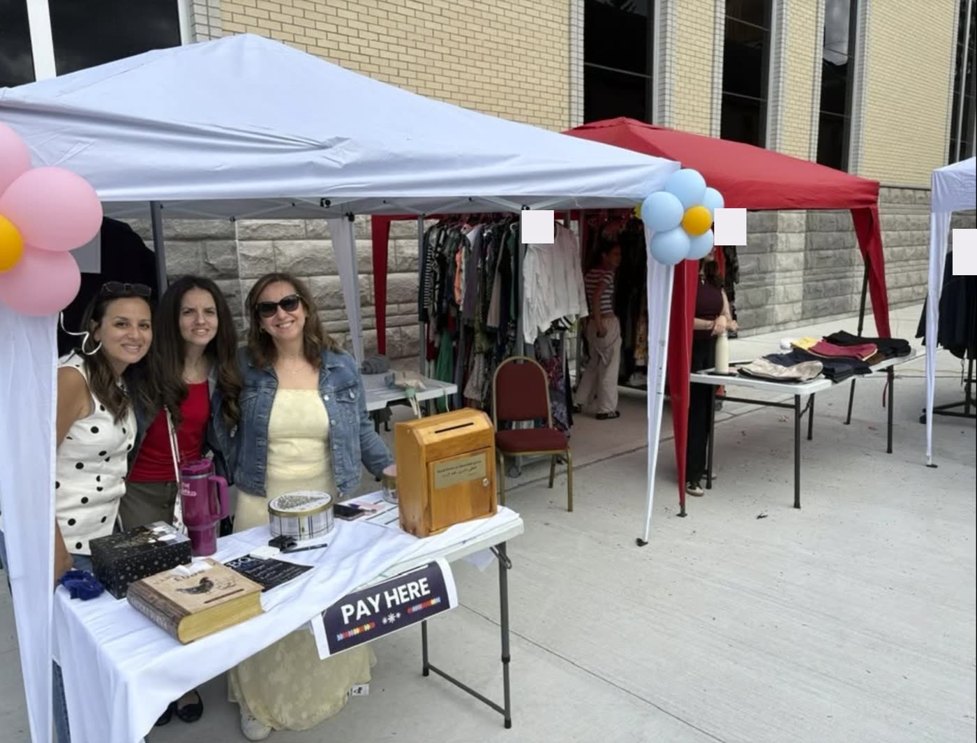 Volunteers at the welcome table of the Spring Cleanout Sale