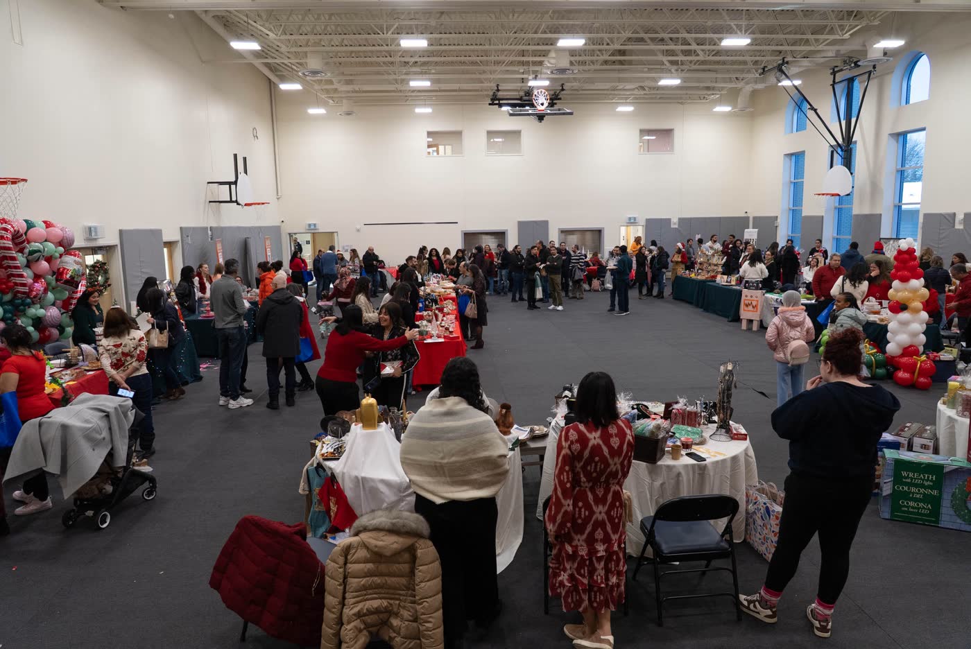 The SMCC gym full of vendors and shoppers at the 2025 Christmas Market