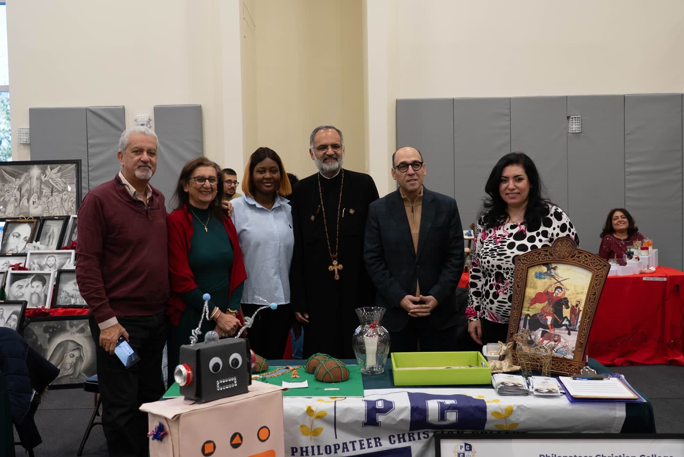 Guests and clergy at a vendor table