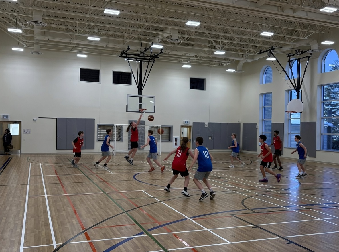 Kids playing basketball in the SMCC gym